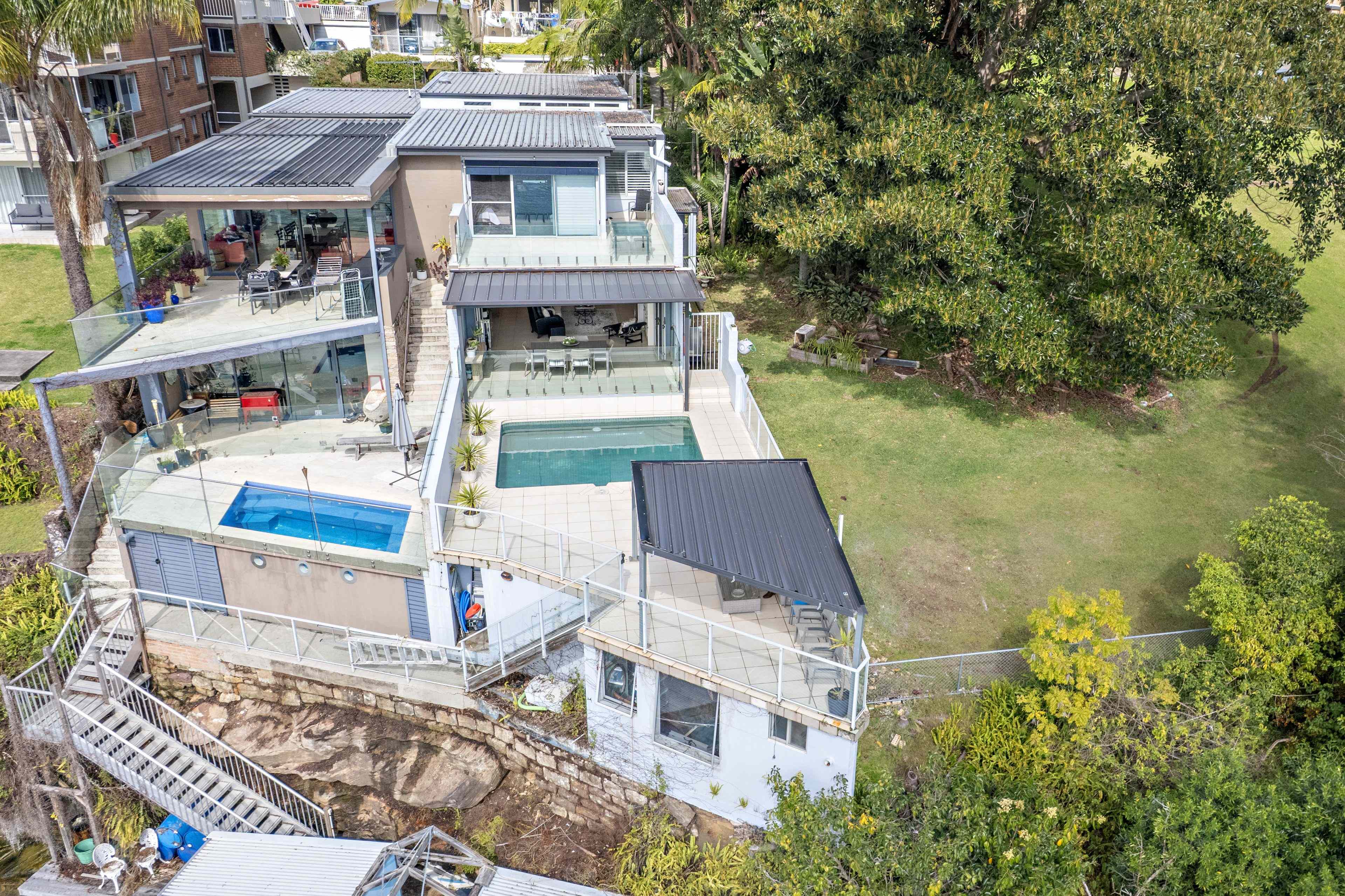 Prop-GPT: House: NSW Drummoyne, NSW 2047 Deep Waterfront Elegance with Private Jetty
