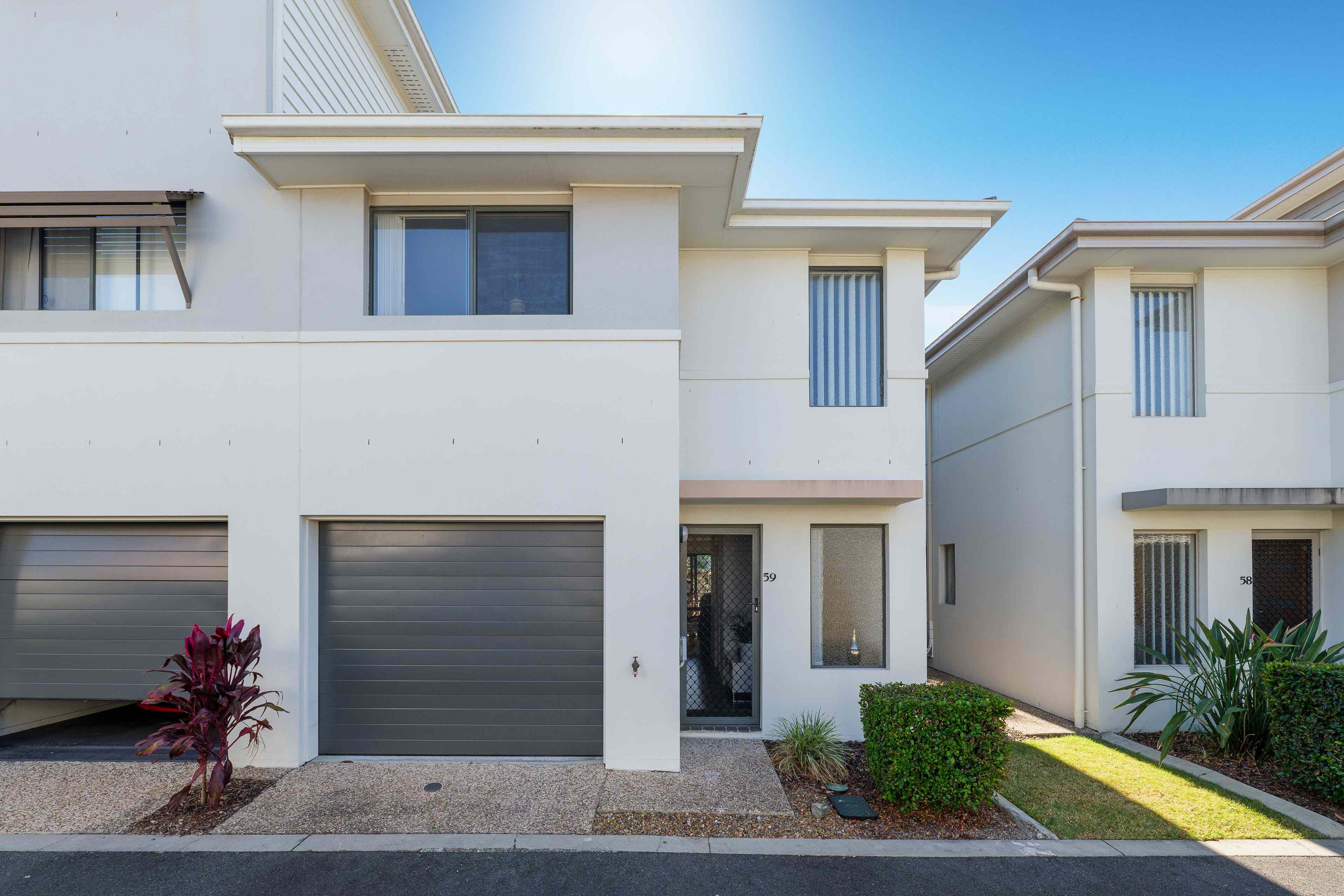 Prop-GPT: Townhouse: QLD Upper Coomera, QLD 4209 Modern Townhome Offering Space, Comfort & Convenience