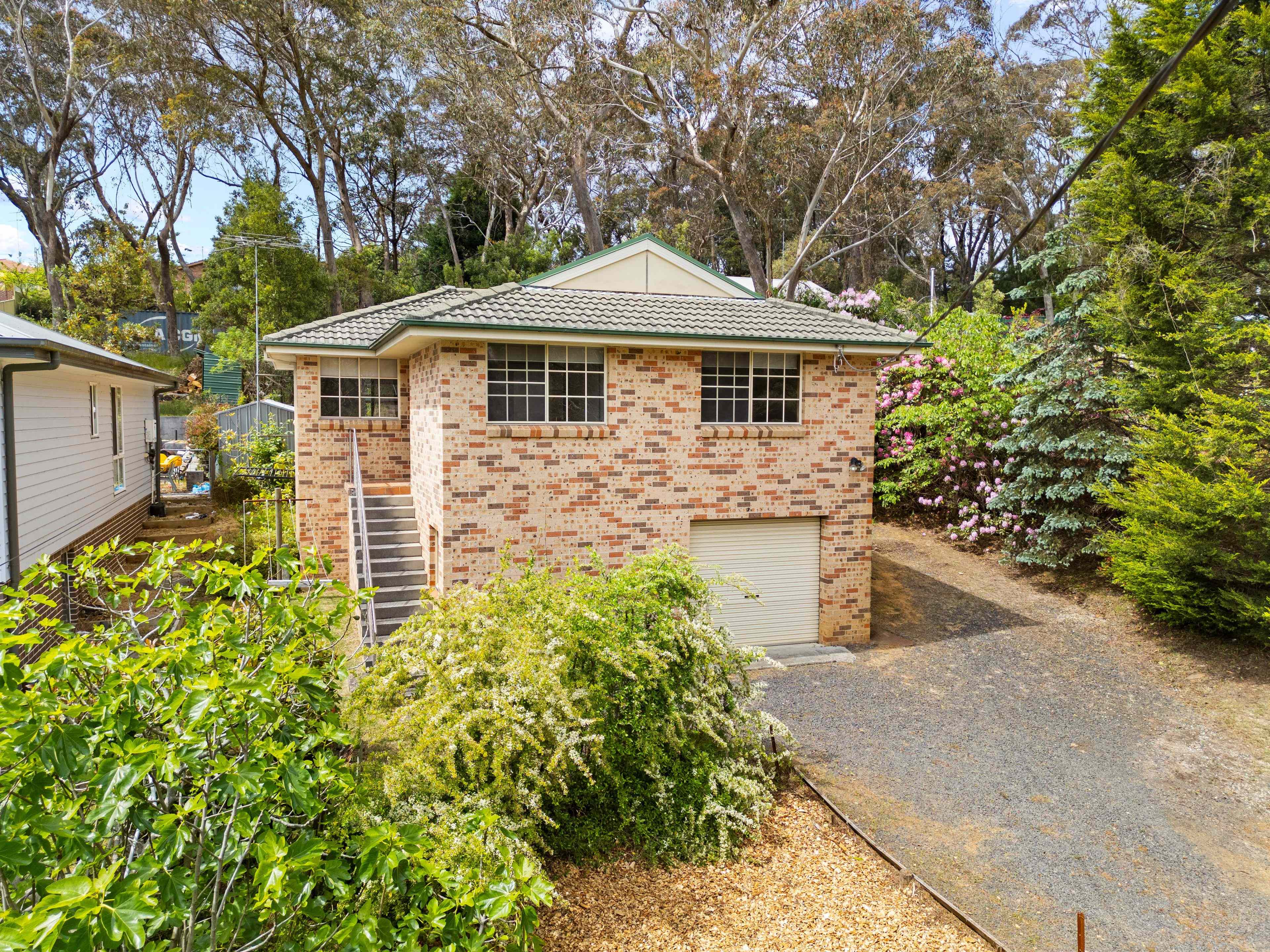 Prop-GPT: House: NSW Blackheath, NSW 2785 SUN-FILLED BRICK HOME WITH PEACEFUL BUSH OUTLOOK