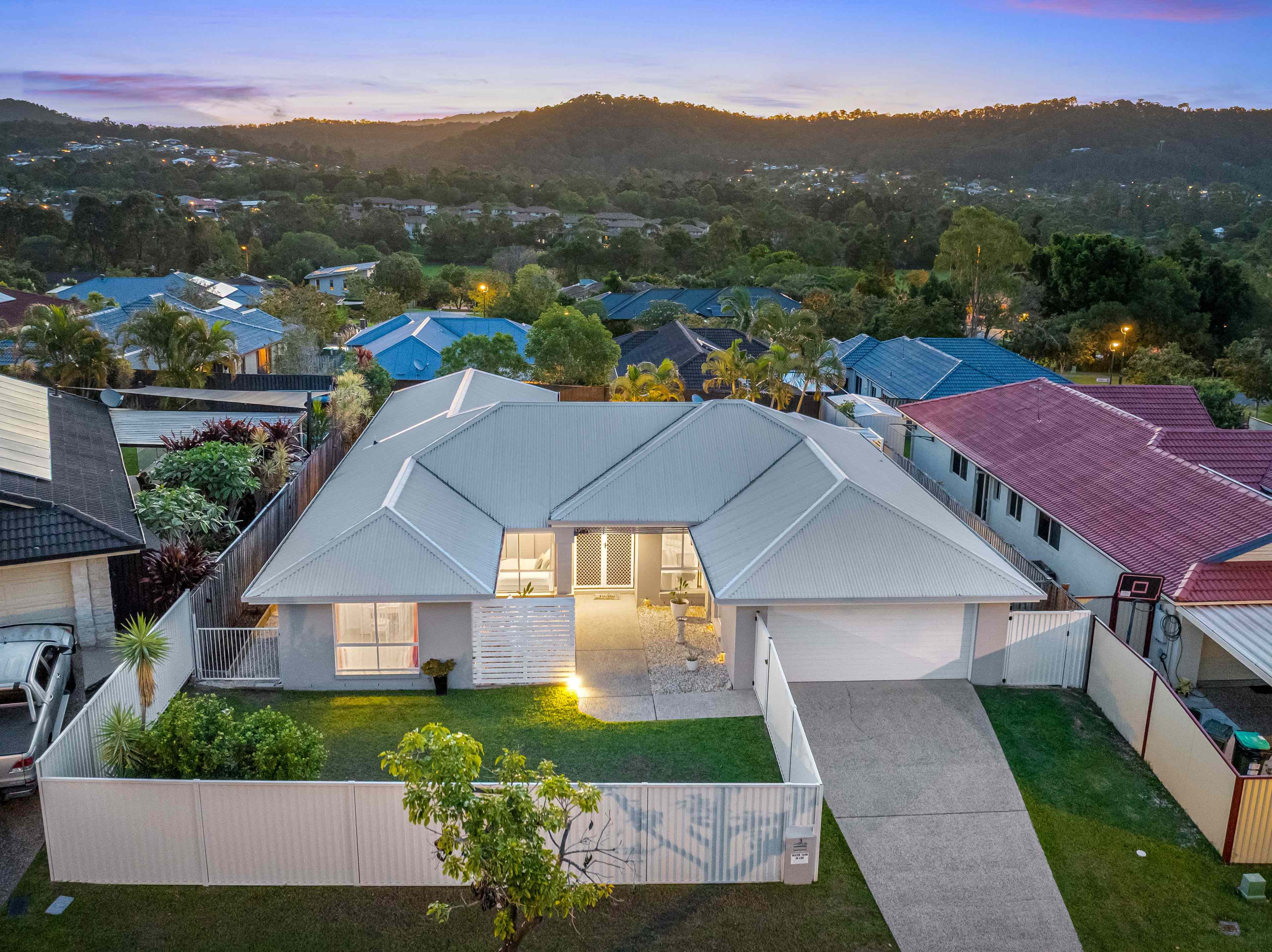 Sunset Views, Resort-Inspired Living & a Private Family Sanctuary!: QLD Pacific Pines, QLD 4211 House | Prop-GPT the AI-Powered Property Portal