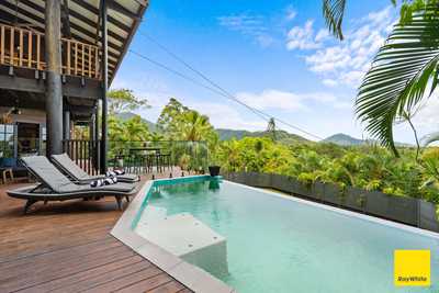 Elevated Timber Pole Home, Ocean Views + Infinity Pool on 1,160m2: QLD Smithfield, QLD 4878 House | Prop-GPT the AI-Powered Property Portal