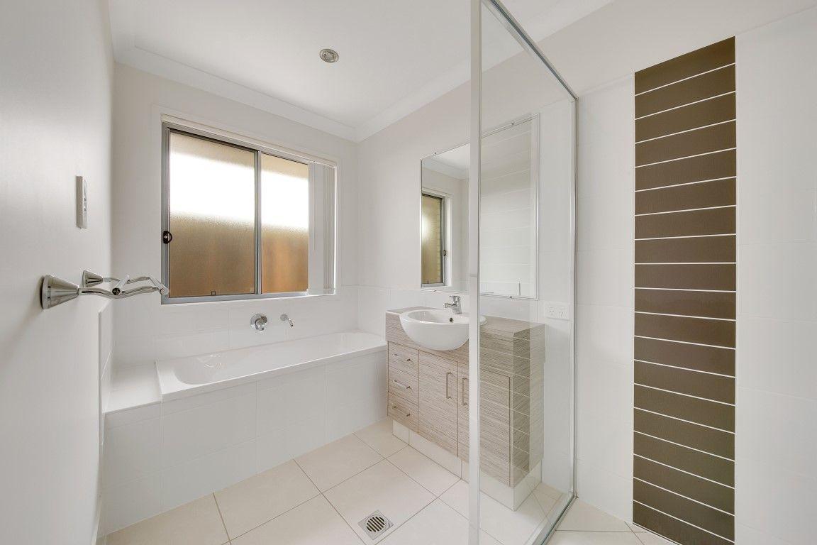 LOOKS GOOD, FEELS GREAT!  IDEAL LOW MAINTENANCE 4 BEDROOM RESIDENCE