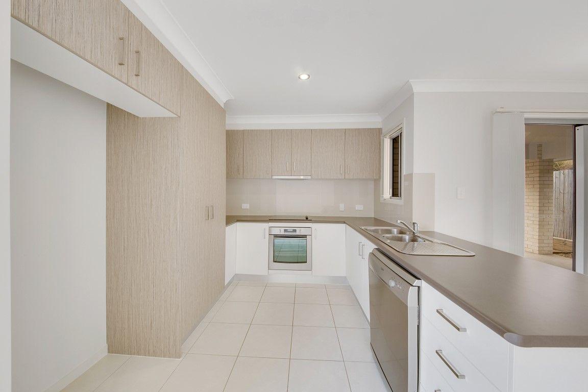 LOOKS GOOD, FEELS GREAT!  IDEAL LOW MAINTENANCE 4 BEDROOM RESIDENCE