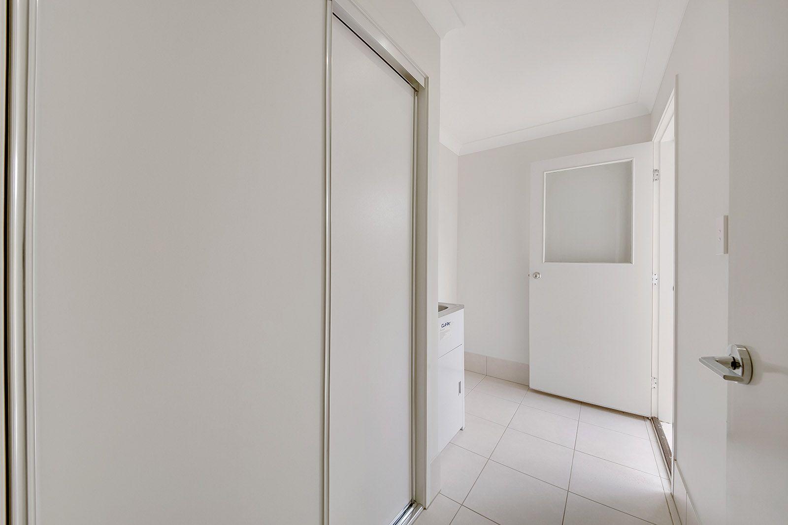 LOOKS GOOD, FEELS GREAT!  IDEAL LOW MAINTENANCE 4 BEDROOM RESIDENCE