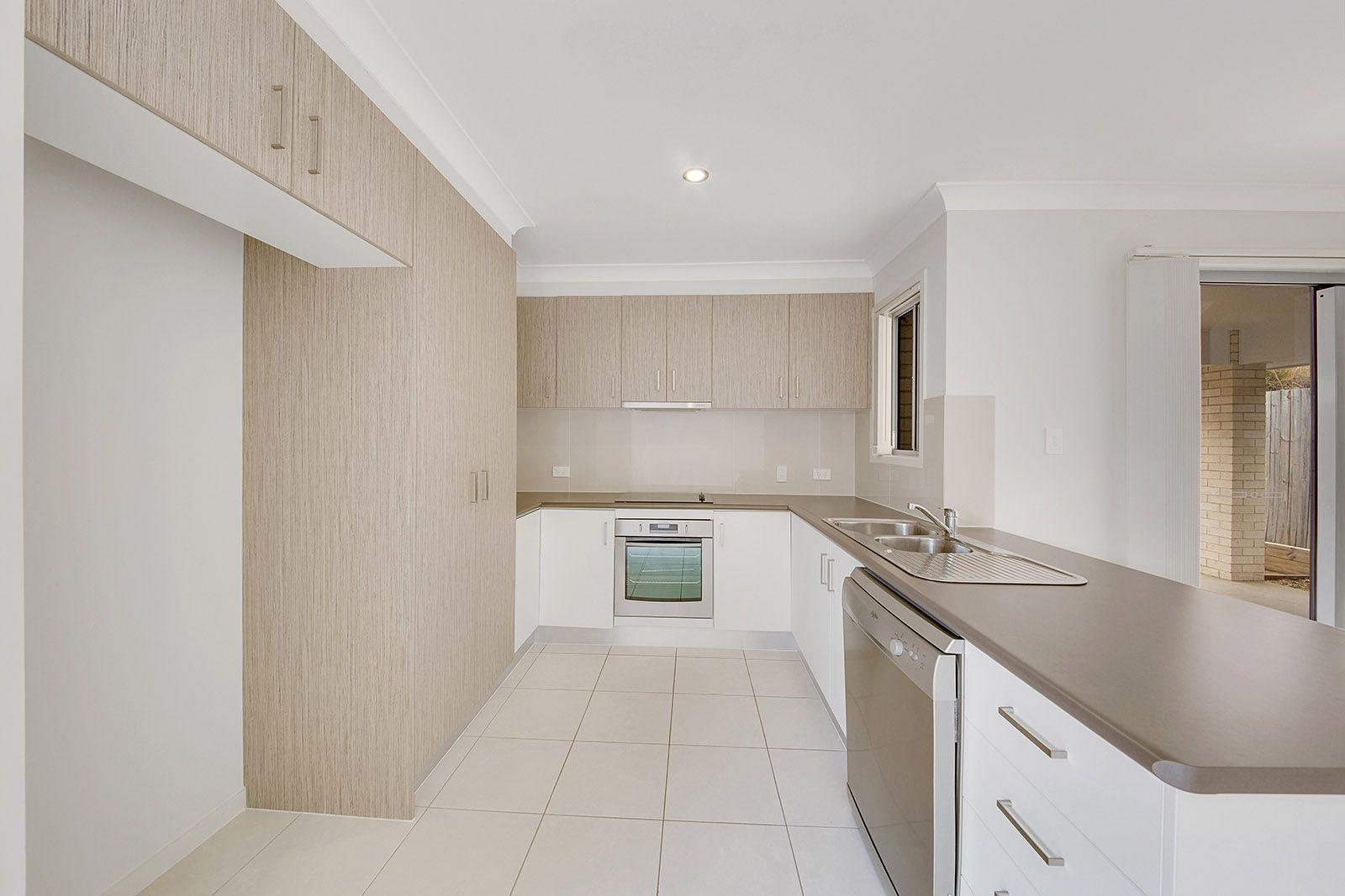 LOOKS GOOD, FEELS GREAT!  IDEAL LOW MAINTENANCE 4 BEDROOM RESIDENCE