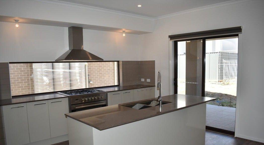 Prop-GPT: House: NSW Denham Court, NSW 2565 Spacious Family Living!