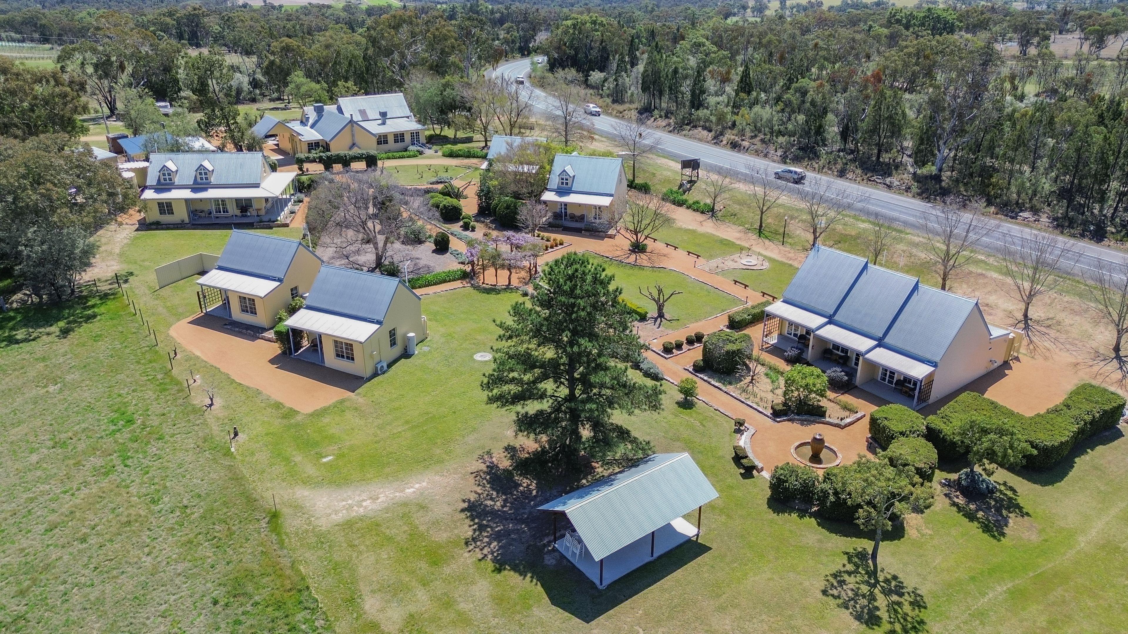 Prop-GPT: Lifestyle: QLD Ballandean, QLD 4382 Vineyard Cottages & Café - where country charm meets commercial opportunity at the gateway to Queensland's Granite Belt.