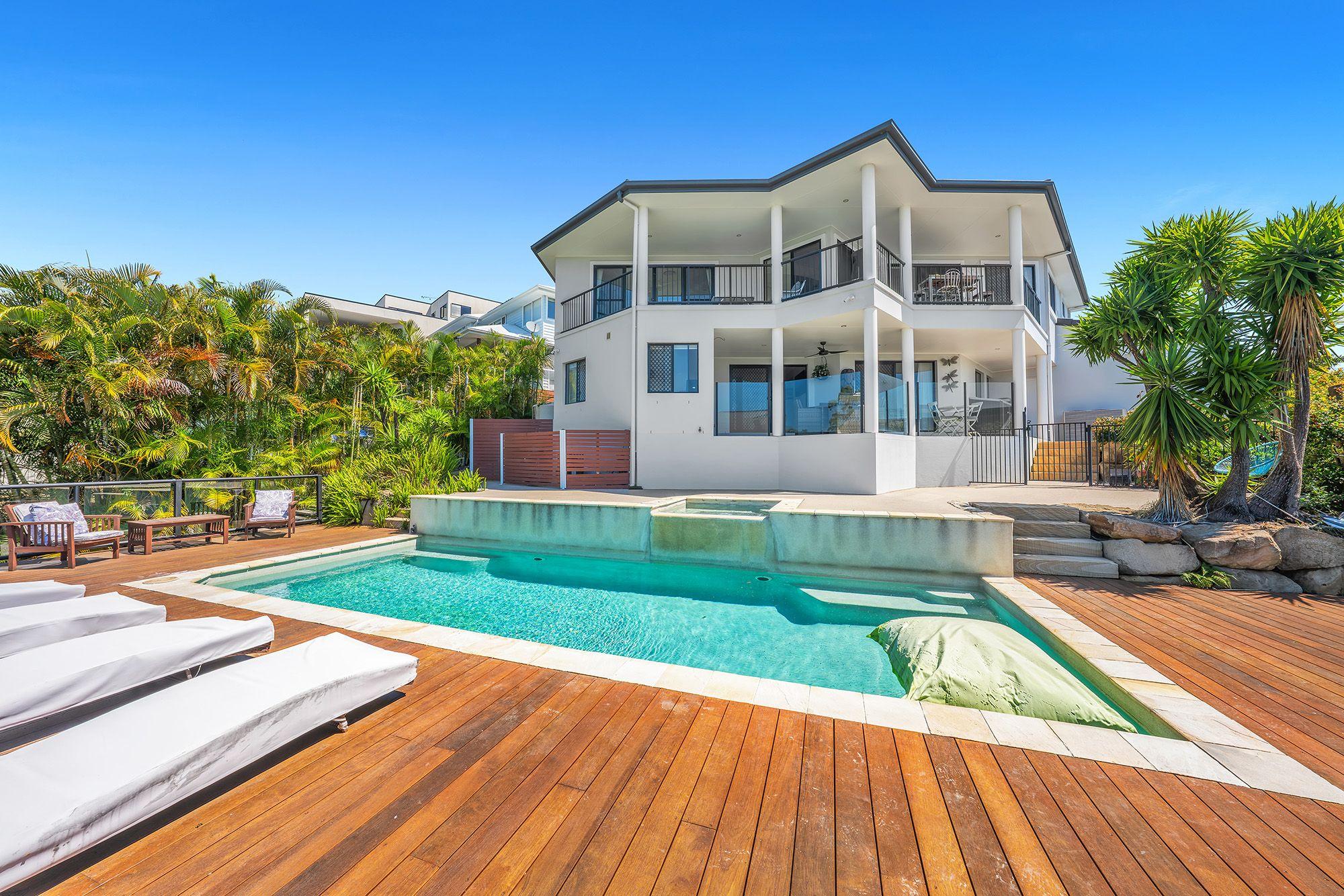 Prop-GPT: House: QLD Reedy Creek, QLD 4227 Dual Living Home with Skyline Views, Study, and Poolside Entertaining