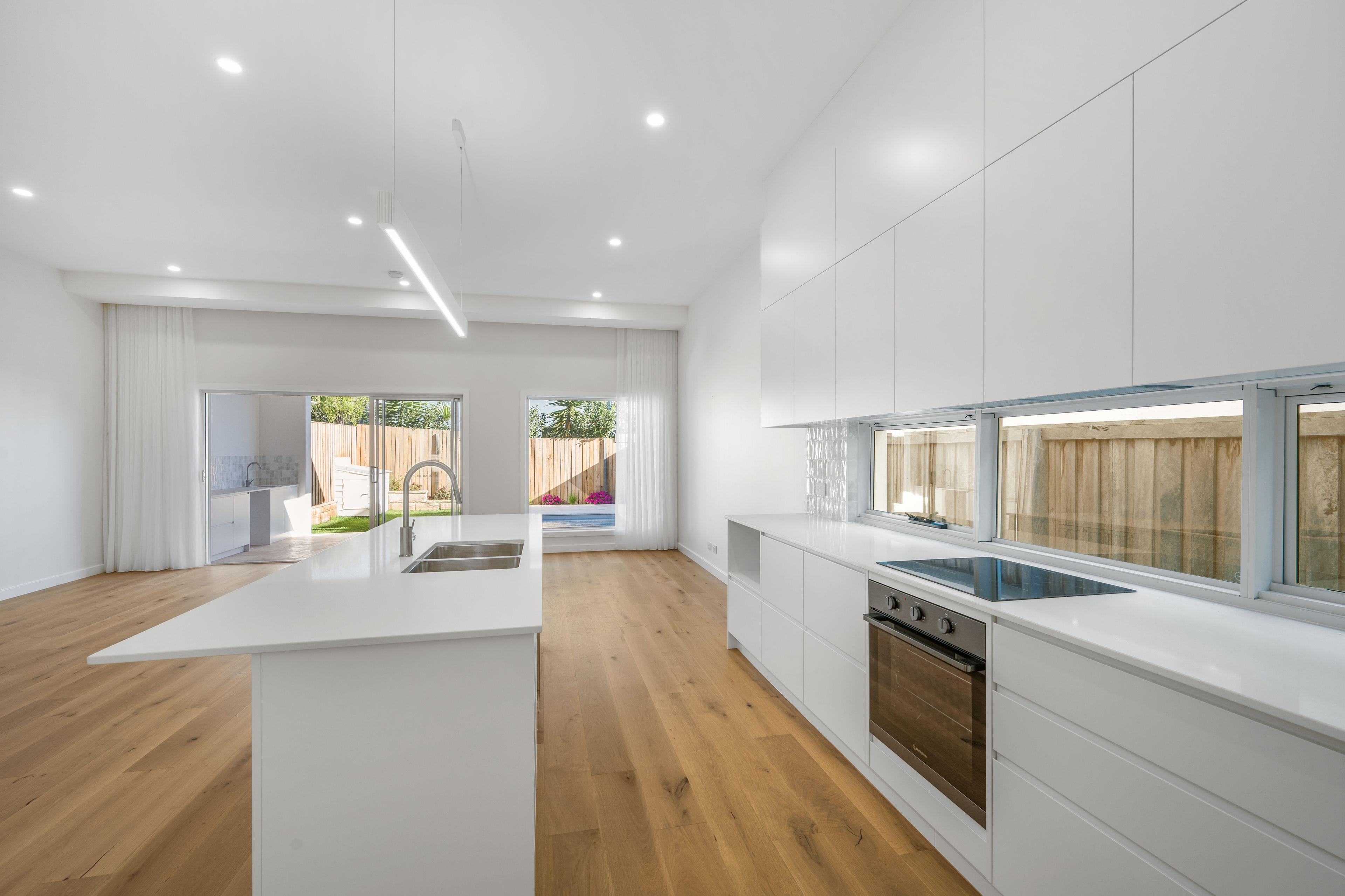 Coastal Living at Its Finest - Modern 3-Bedroom Duplex Steps from the Beach