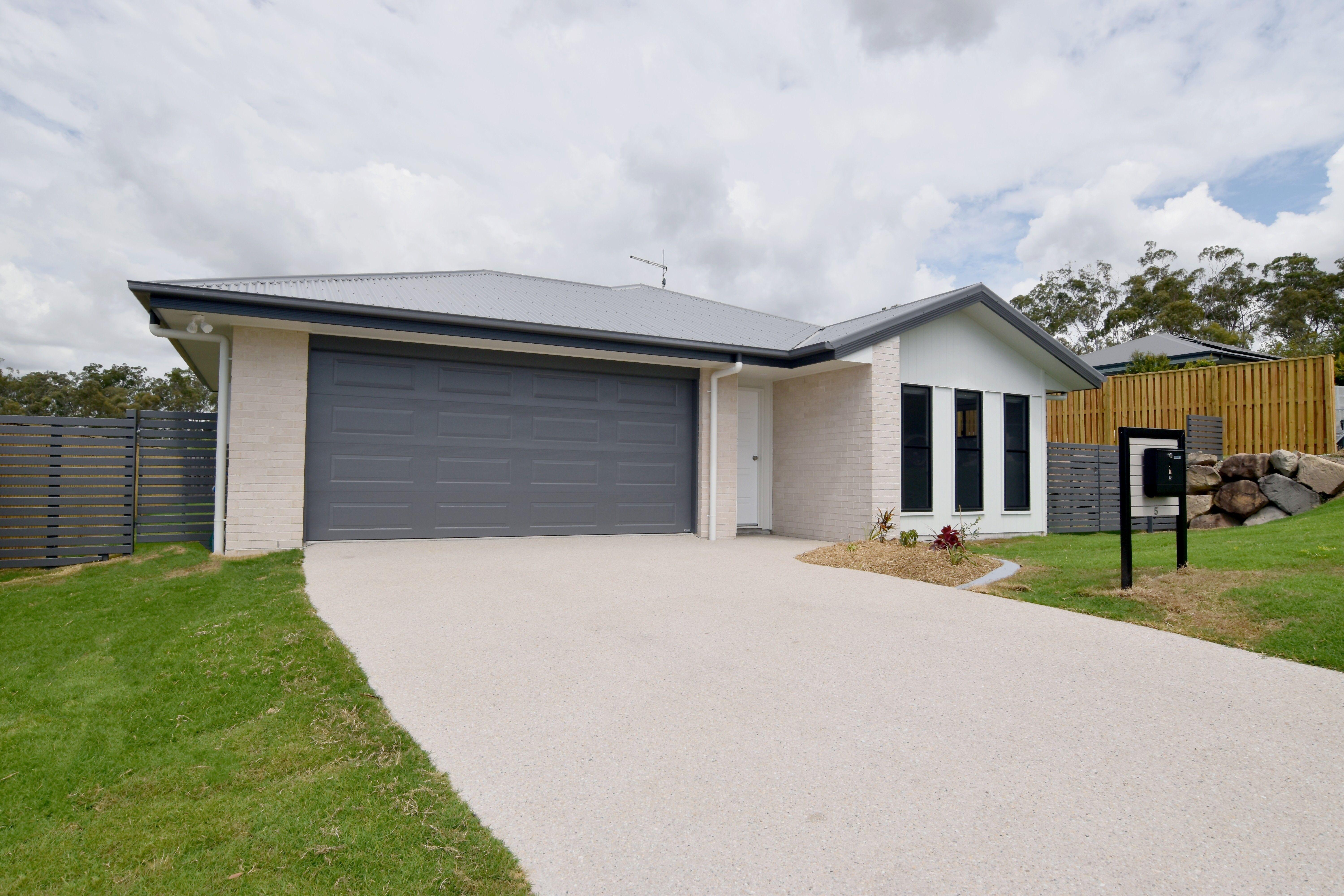 MODERN FOUR BEDROOM HOME IN THE HEART OF RIVERSTONE RISE