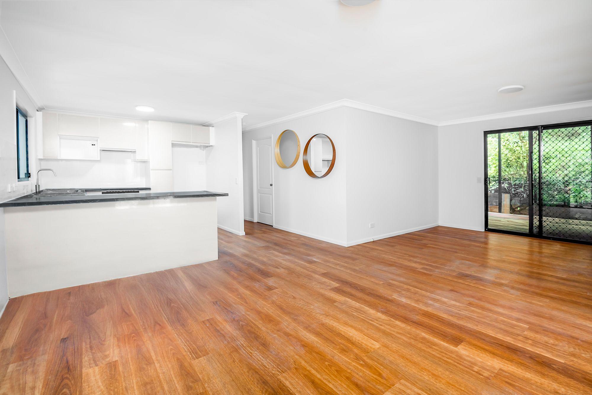 Prop-GPT: House: QLD Bonogin, QLD 4213 PRIVATE HOME IN BUSH SETTING