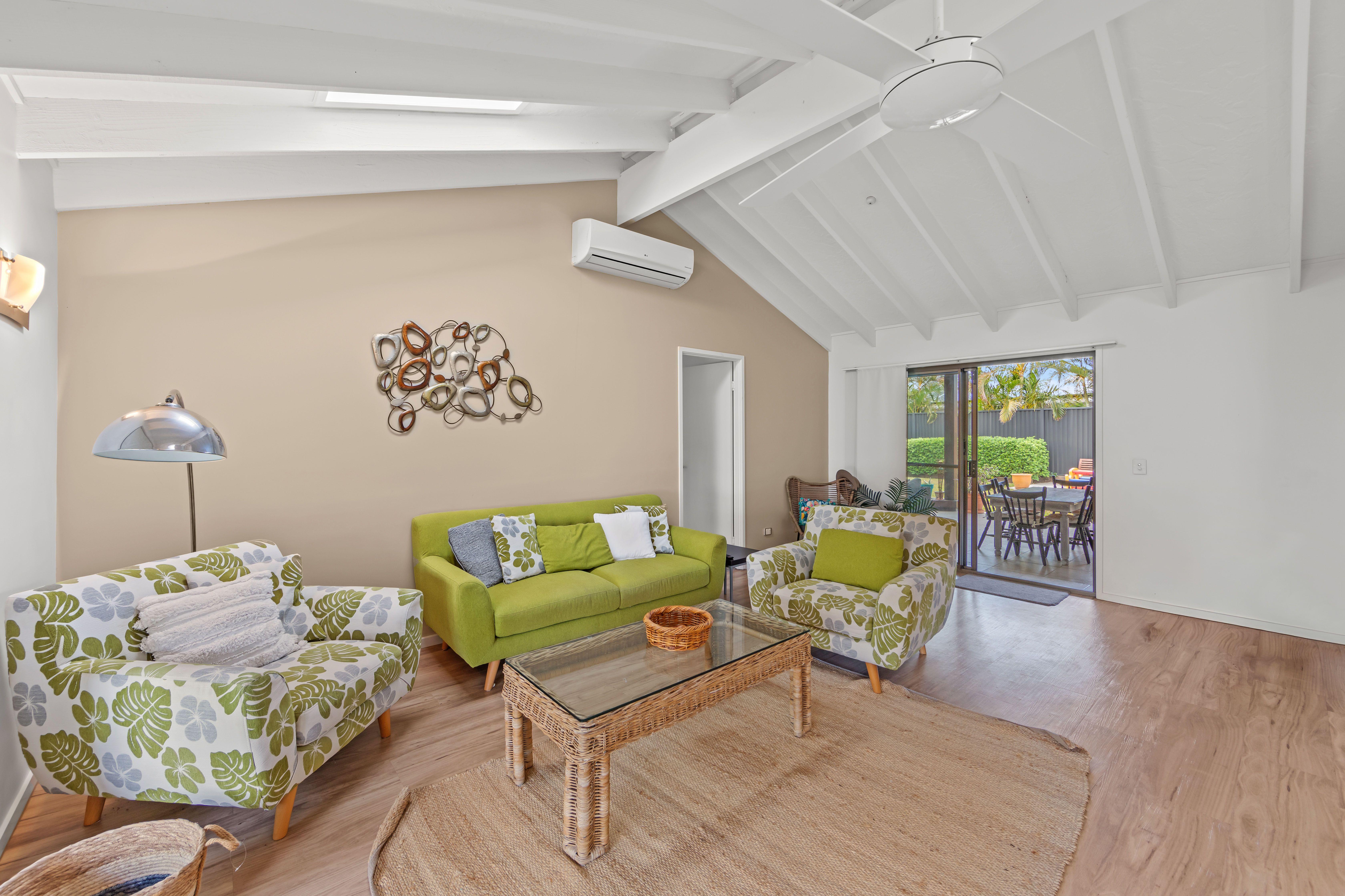 Prop-GPT: House: QLD Runaway Bay, QLD 4216 Charming Family Home in Runaway Bay