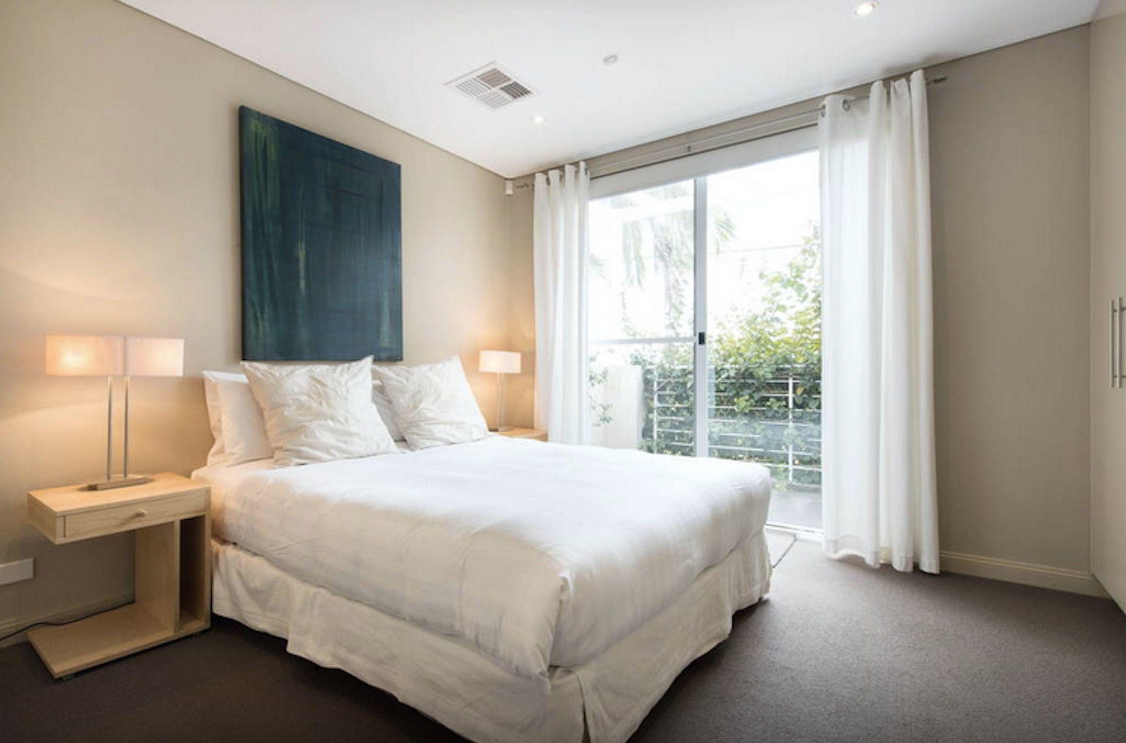 DECEPTIVELY LARGE, GORGEOUS DESIGNER HOME ON QUIET RESIDENTIAL STREET, WITH HARBOUR VIEWS!