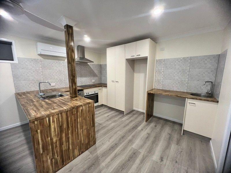 NEWLY RENOVATED… DOWNSTAIRS UNIT