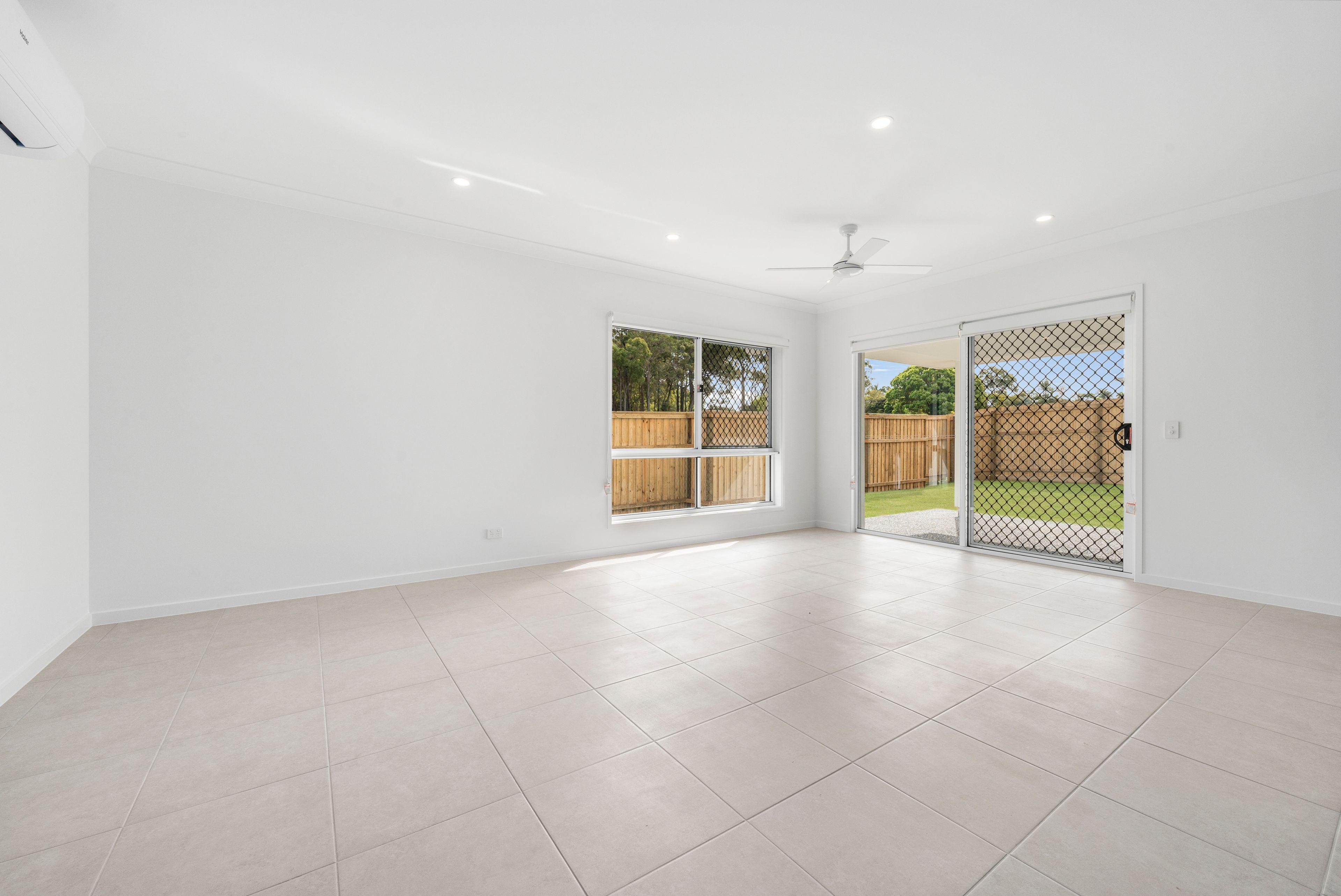 NEAR NEW FOUR BEDROOM HOME WITH TWO LIVING AREAS