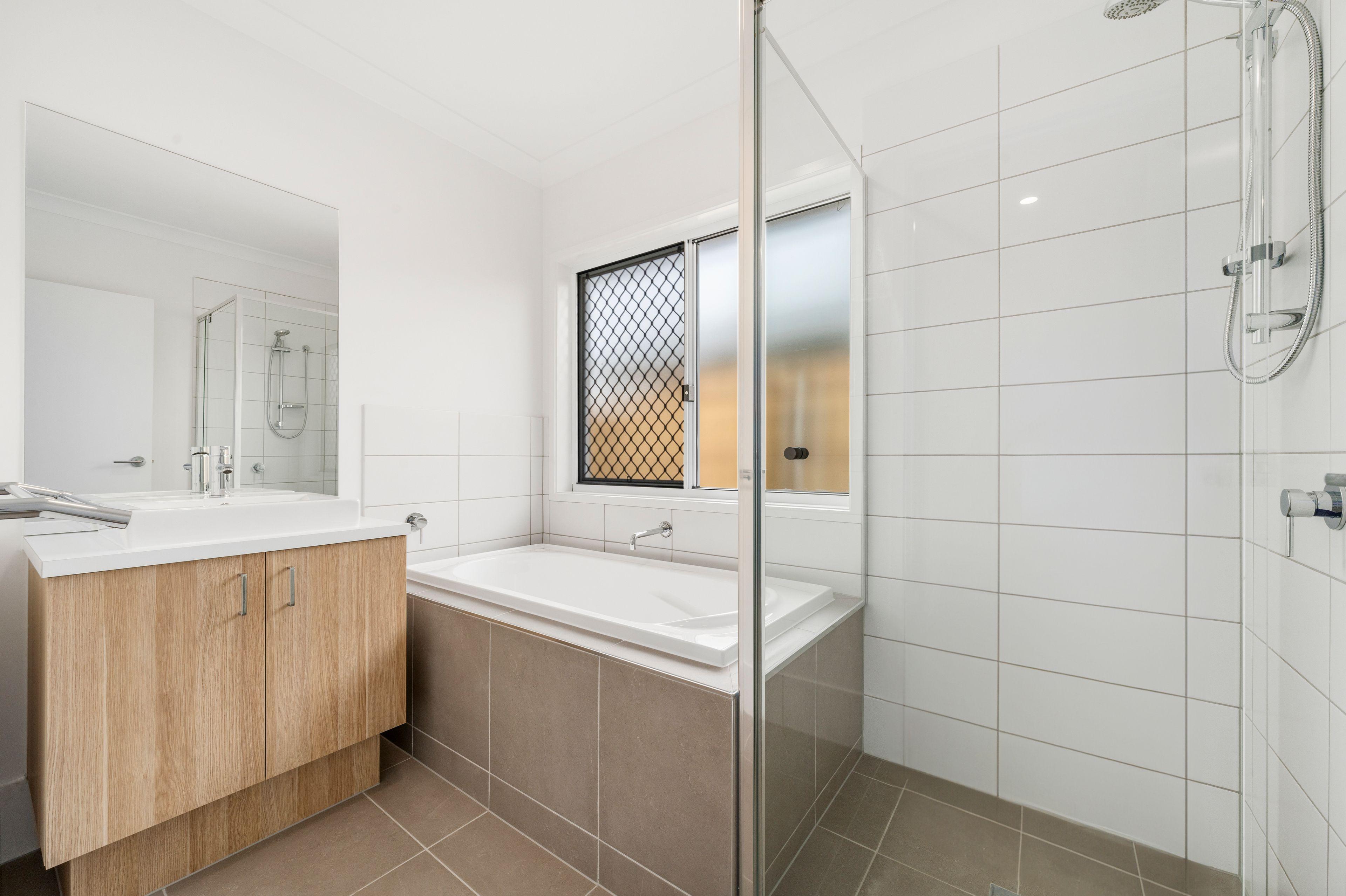 NEAR NEW FOUR BEDROOM HOME WITH TWO LIVING AREAS