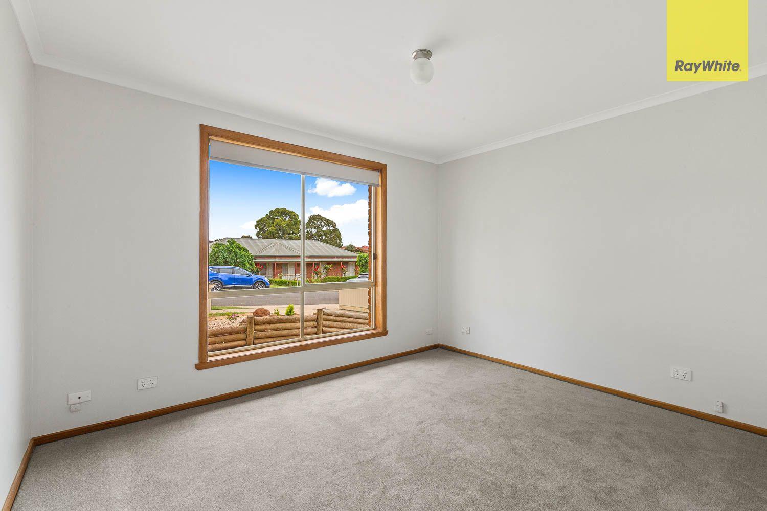 NEAT WITH A LARGE WELL ESTABLISHED YARD