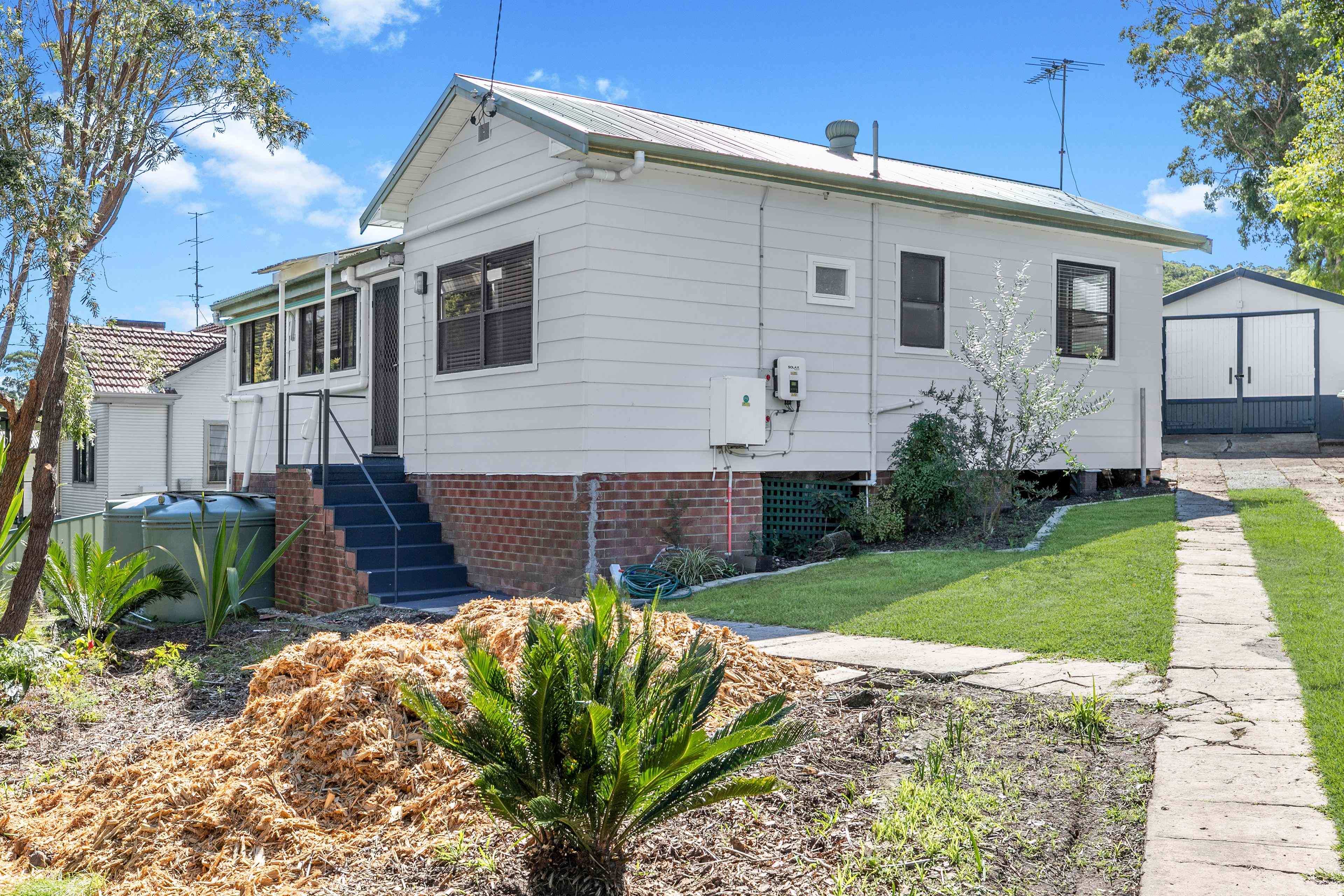 CHARMING 2-BEDROOM HOME WITH SUNROOM, LARGE GARDEN & REAR DECK: NSW Fennell Bay, NSW 2283 House | Prop-GPT the AI-Powered Property Portal